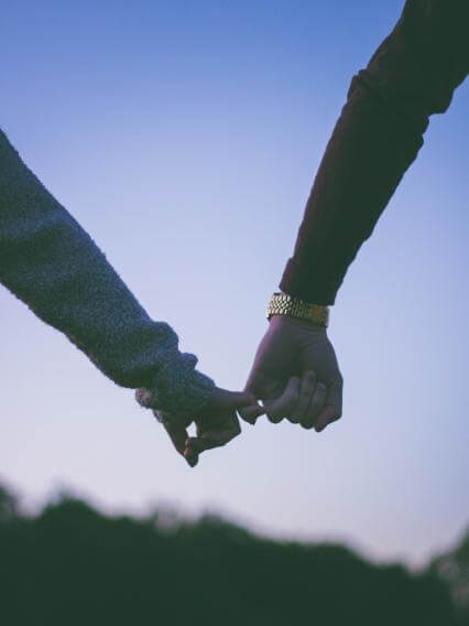 Image of to people holding pinkies. Representing the type of relationship that you can get with the help of a dating coach in Salem, Oregon. Find the right connection for you with dating coaching in Oregon.