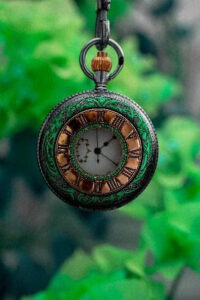 Image of a green and gold stop watch. Showing that life coaching in Oregon can help with time management. A life coach for autistic adults in Portland, OR can help tailor sessions to your needs.