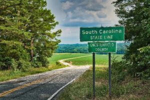 Image of a state line sign for South Carolina leading into Chesterfield County. Representing that ADHD and autism testing is available throughout South Carolina. It is never too late for an adult ASD assessment.
